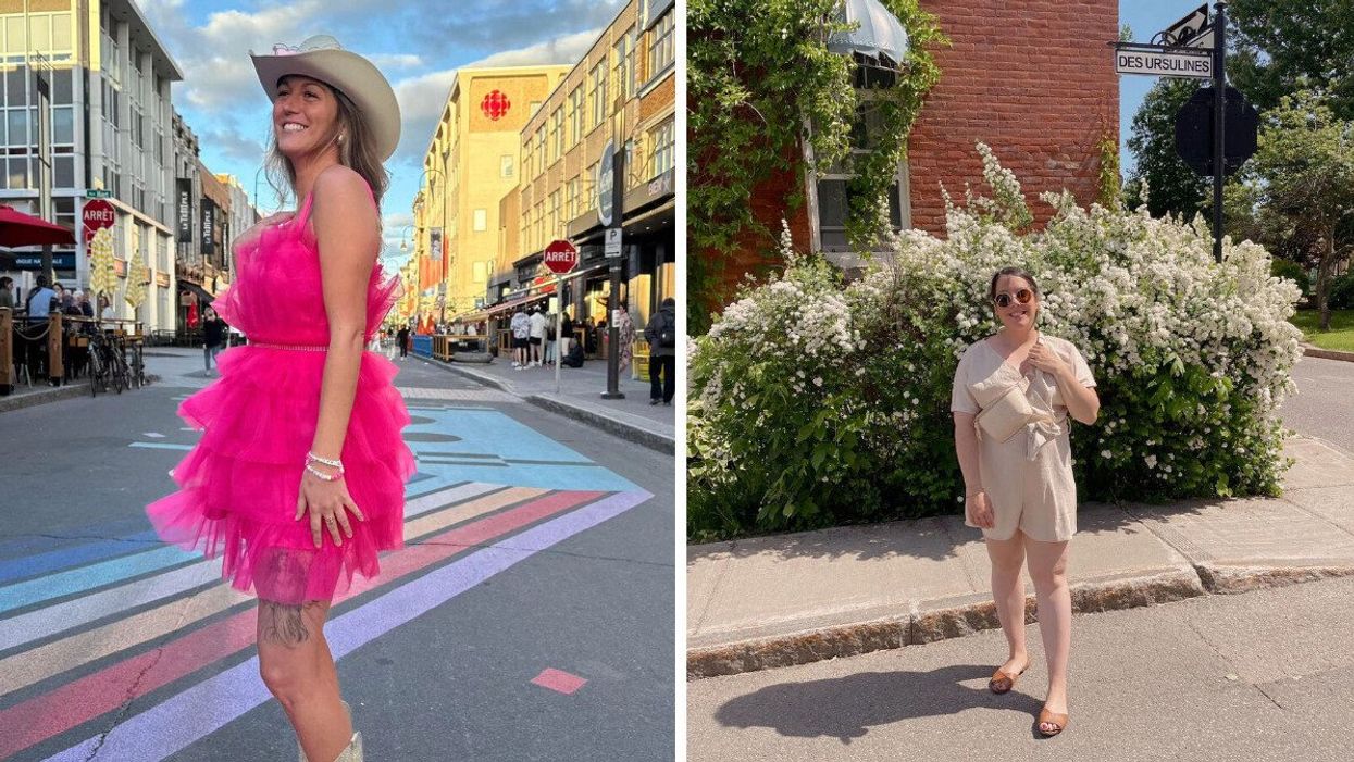 A person standing on a street in a pink dress. A person standing on a street by flowers.