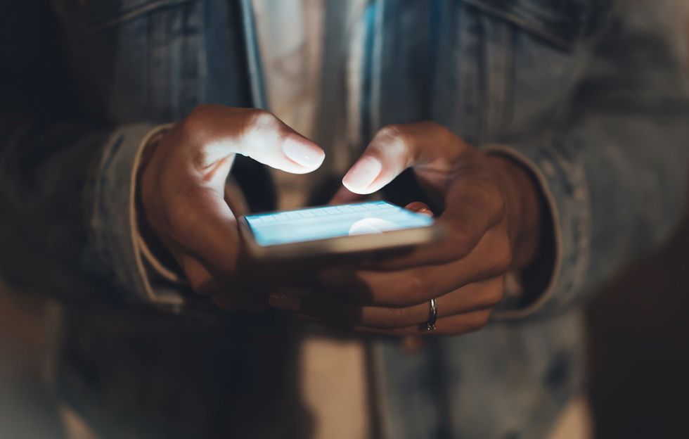 A person texting on their phone.