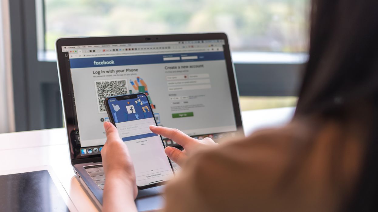 A person uses Facebook.