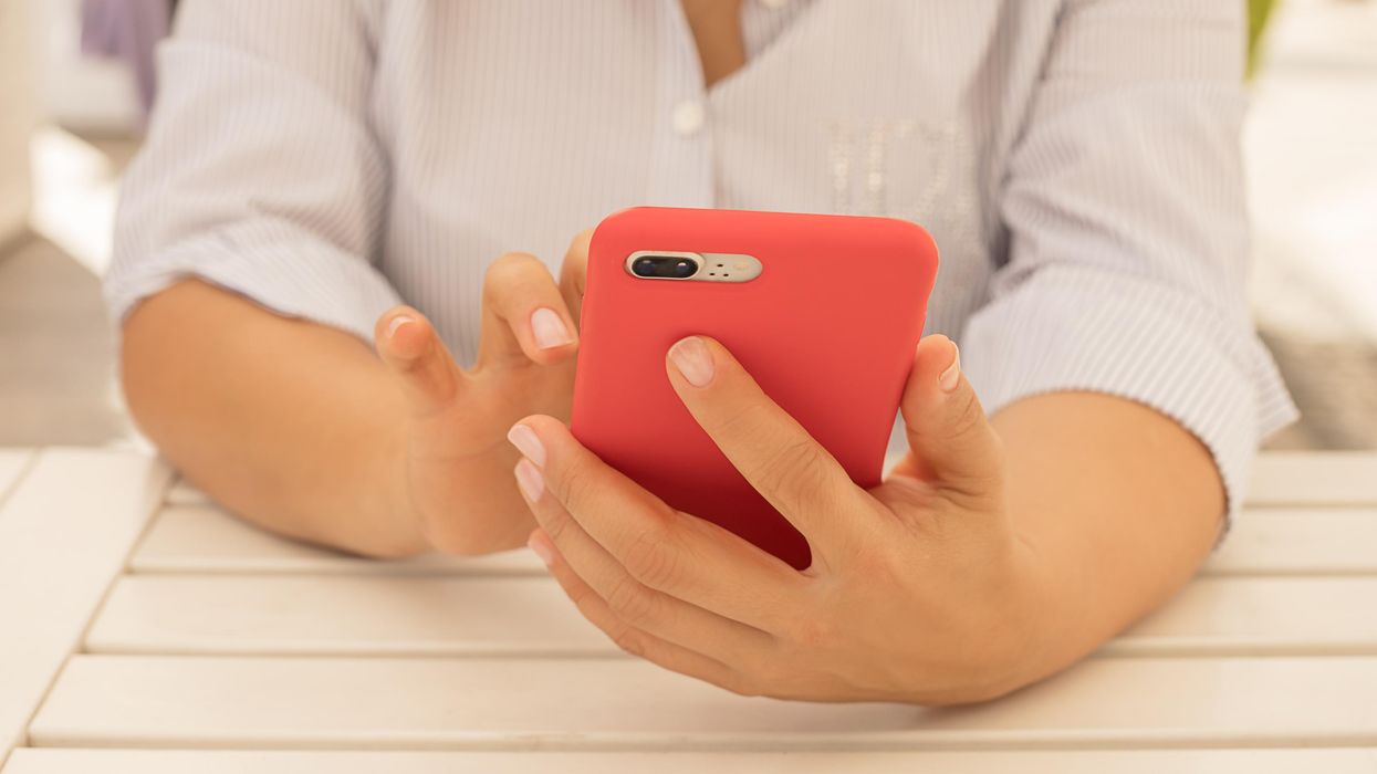 A person using a cellphone.