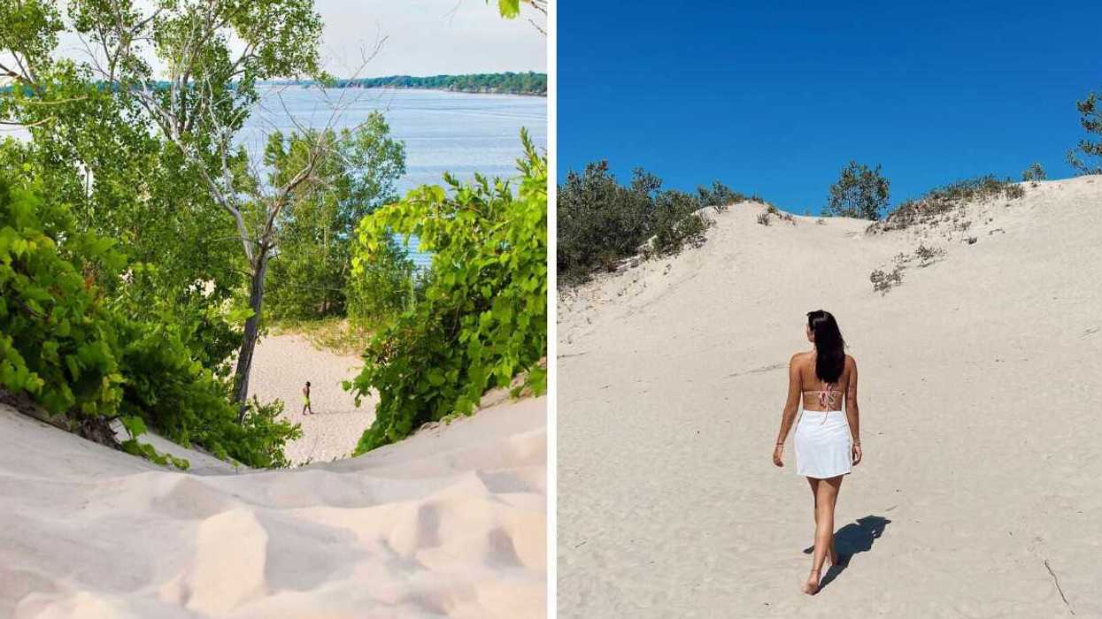 A person walking on a sandy beach.
