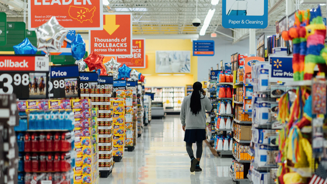 A person walks through a grocery store.