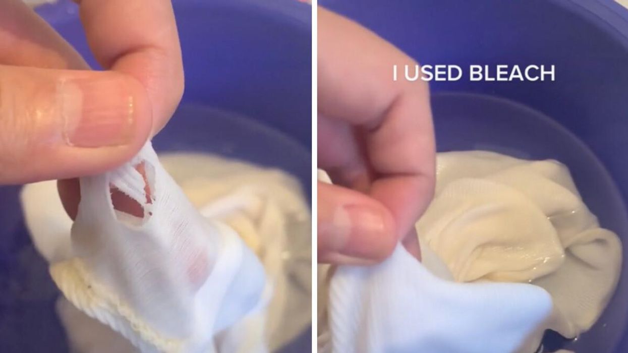A person washing their clothes in bleach.