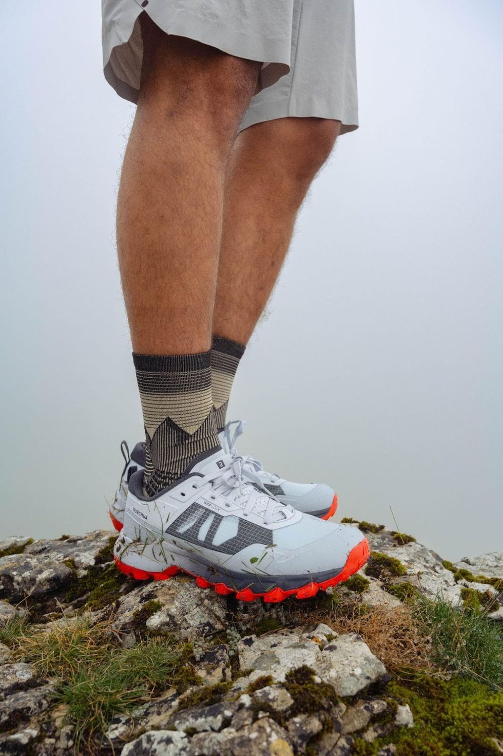 A person wearing Decathlon hiking shoes.