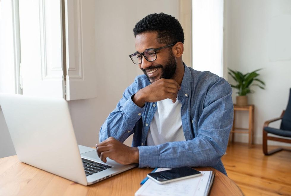 A person working at a laptop. 