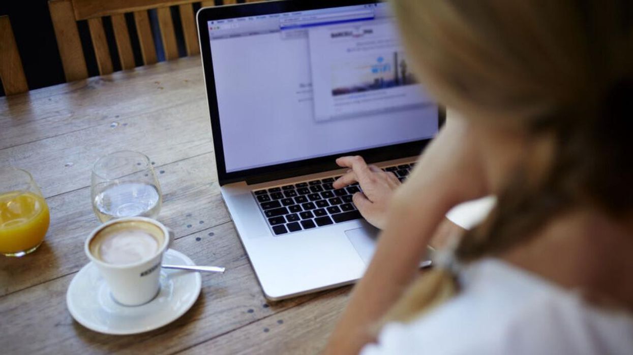 A person working from a laptop.