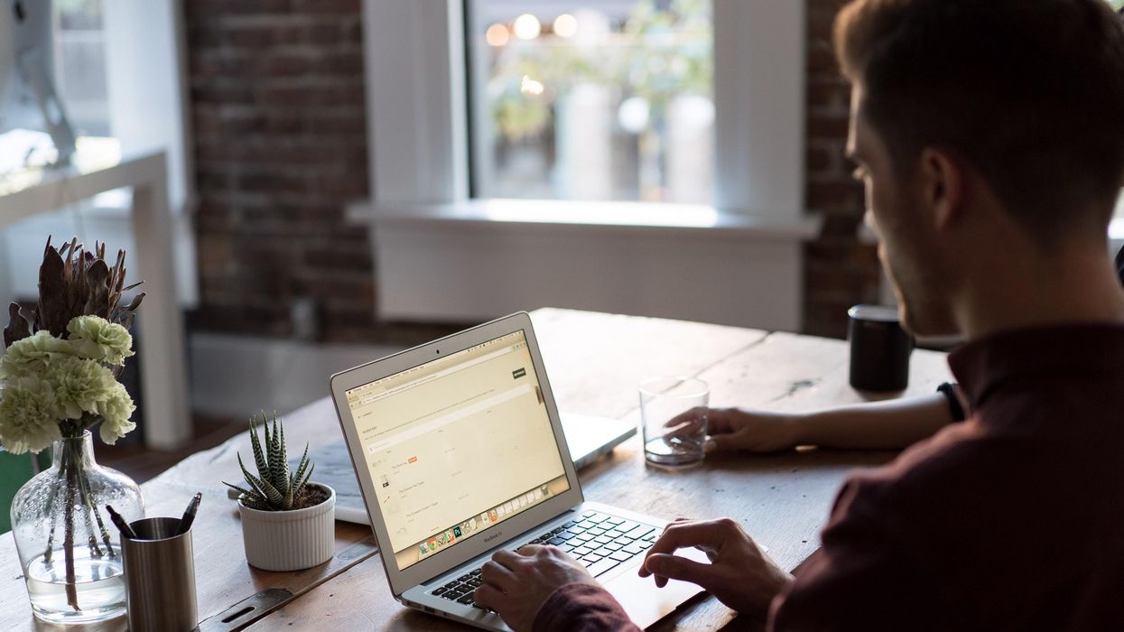 A person working on a laptop.