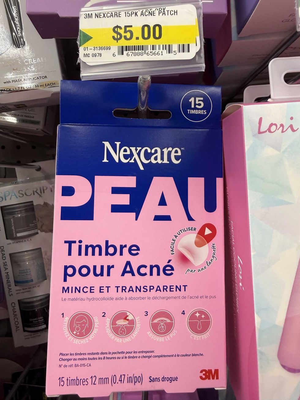 A pink and blue box with a photo of acne patches.