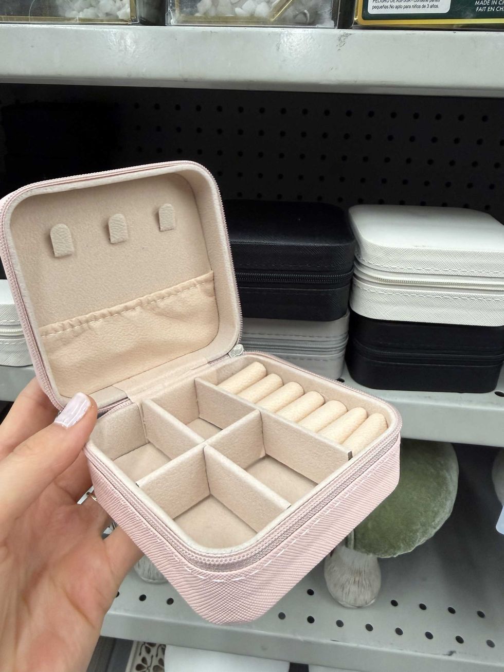 A pink box with divided compartments inside.