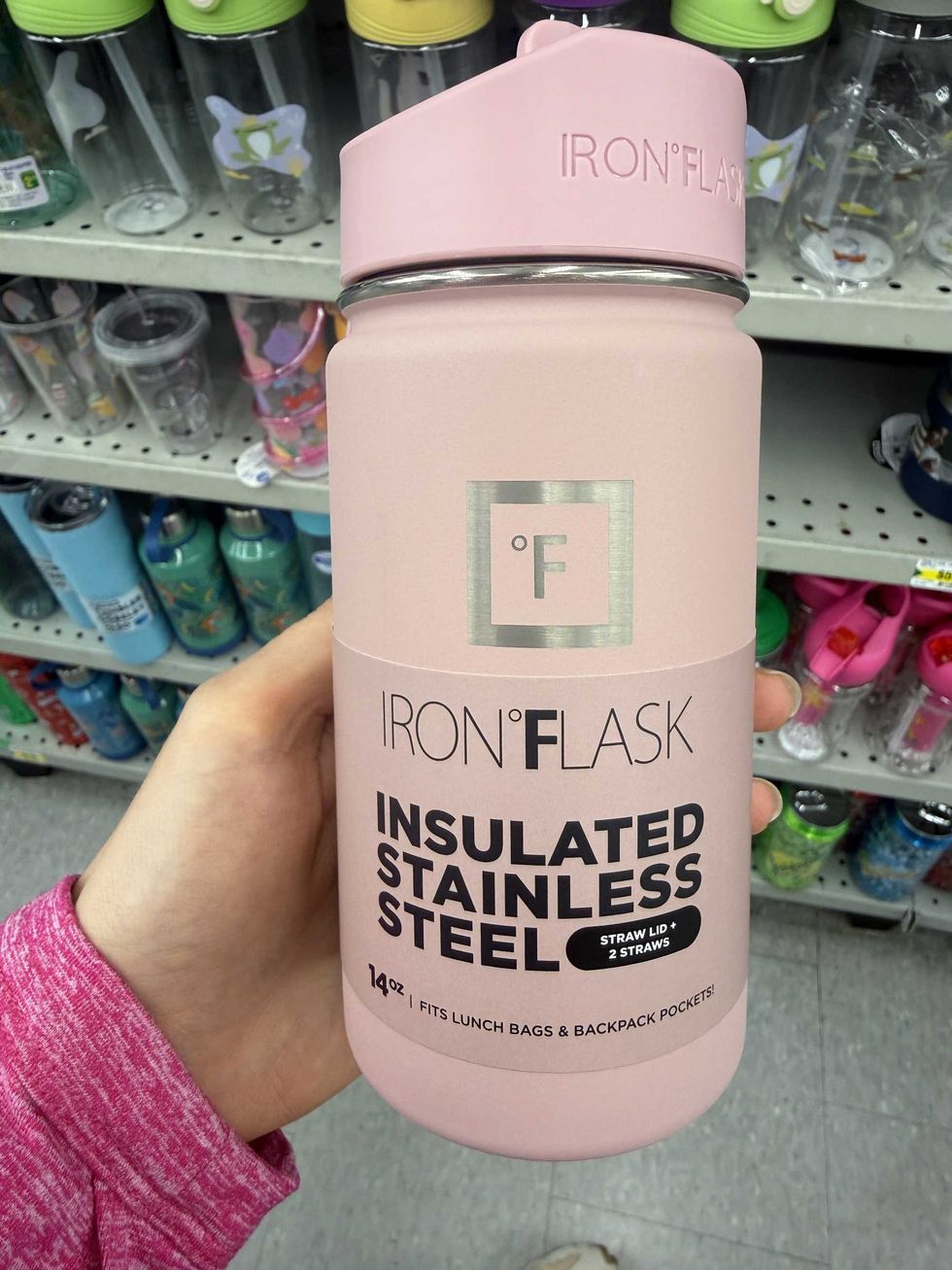 A pink kids water bottle that says Iron Flask insulated stainless steel bottle on it.