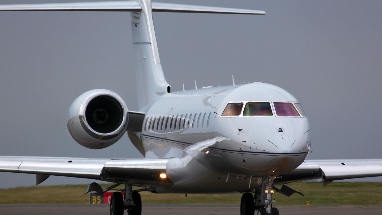 A plane on an airport runway.