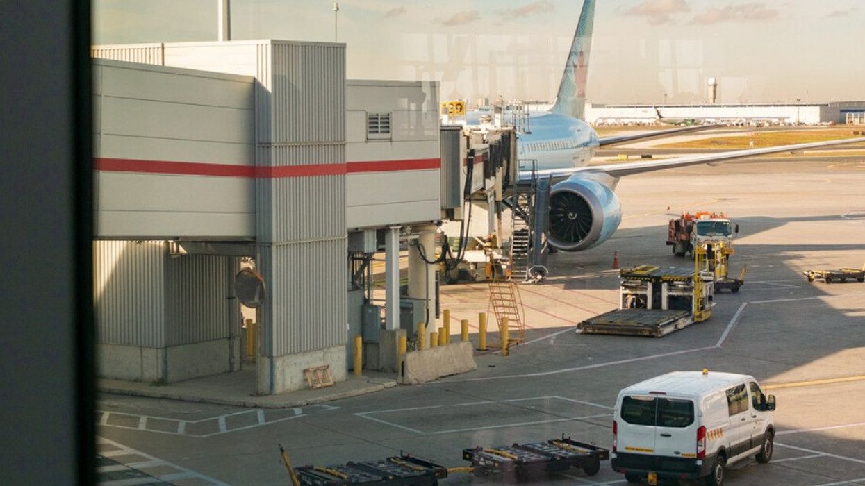 A plane parked at Terminal 1 of Toronto Pearson International Airport (YYZ).
