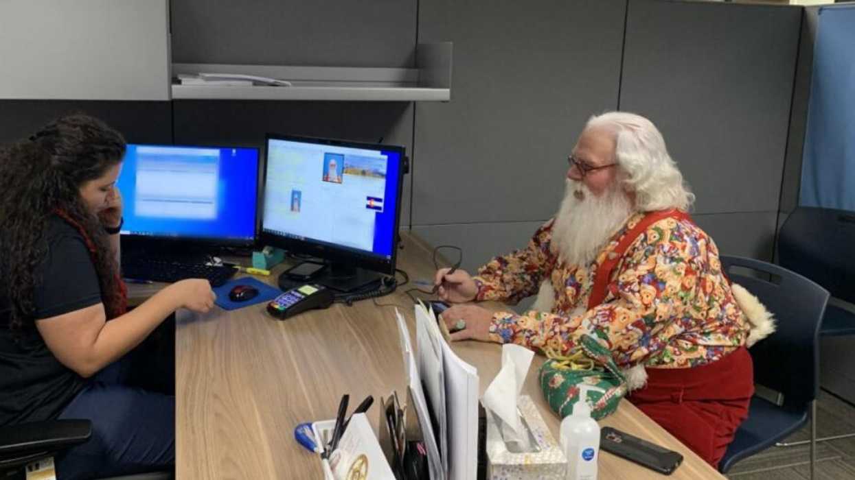 A Police Photo Shows Santa Getting A Gun Permit & The Internet Wants To Know WTF It's For