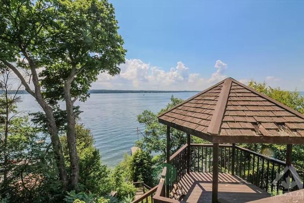 A porch that looks out over the water.