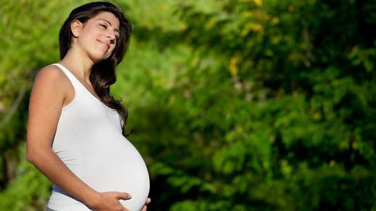 A pregnant woman.