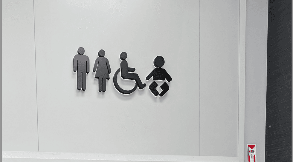 A public washroom sign in Canada.