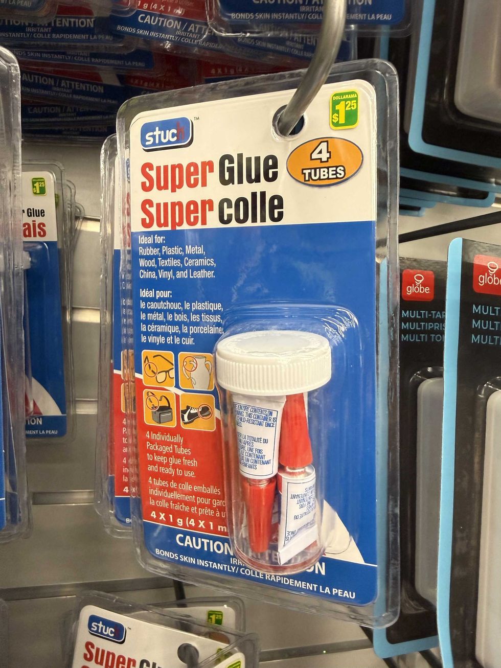 A red and blue package with three tubes of super glue inside.