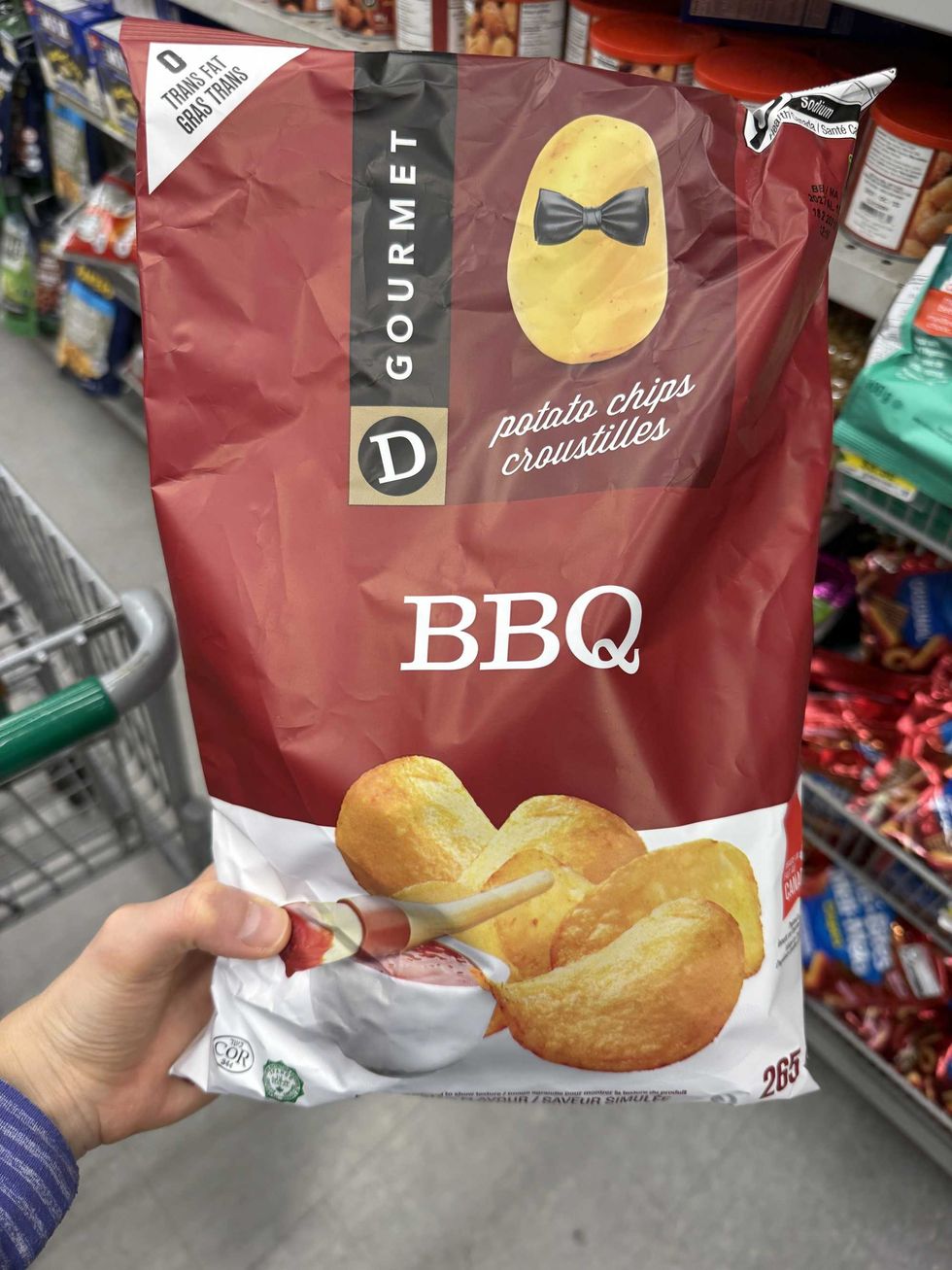 A red and white bag with it reads BBQ potato chips on the front and a photo of chips.