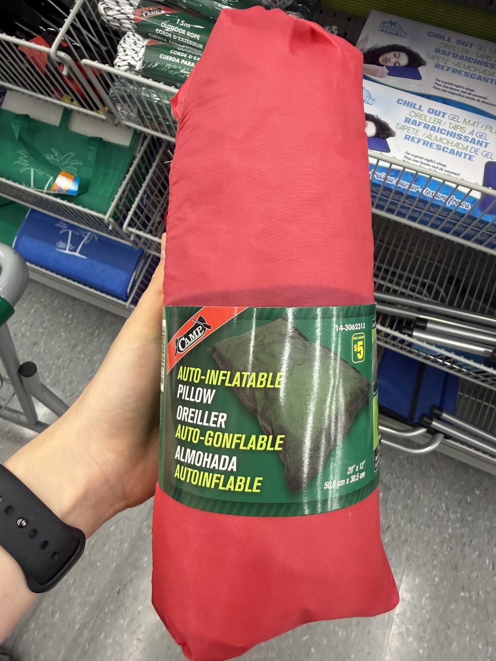 A red bag with a picture of a pillow on the front.