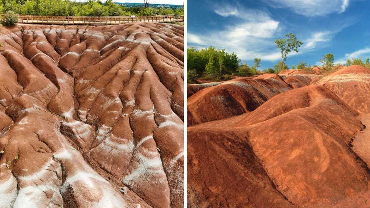 A red rocky landscape with a boardwalk.