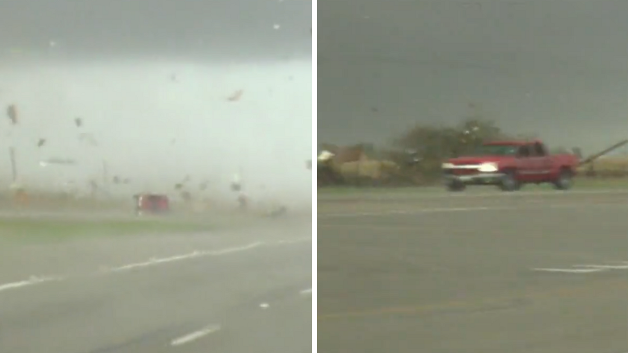 A red truck gets tossed by tornado.