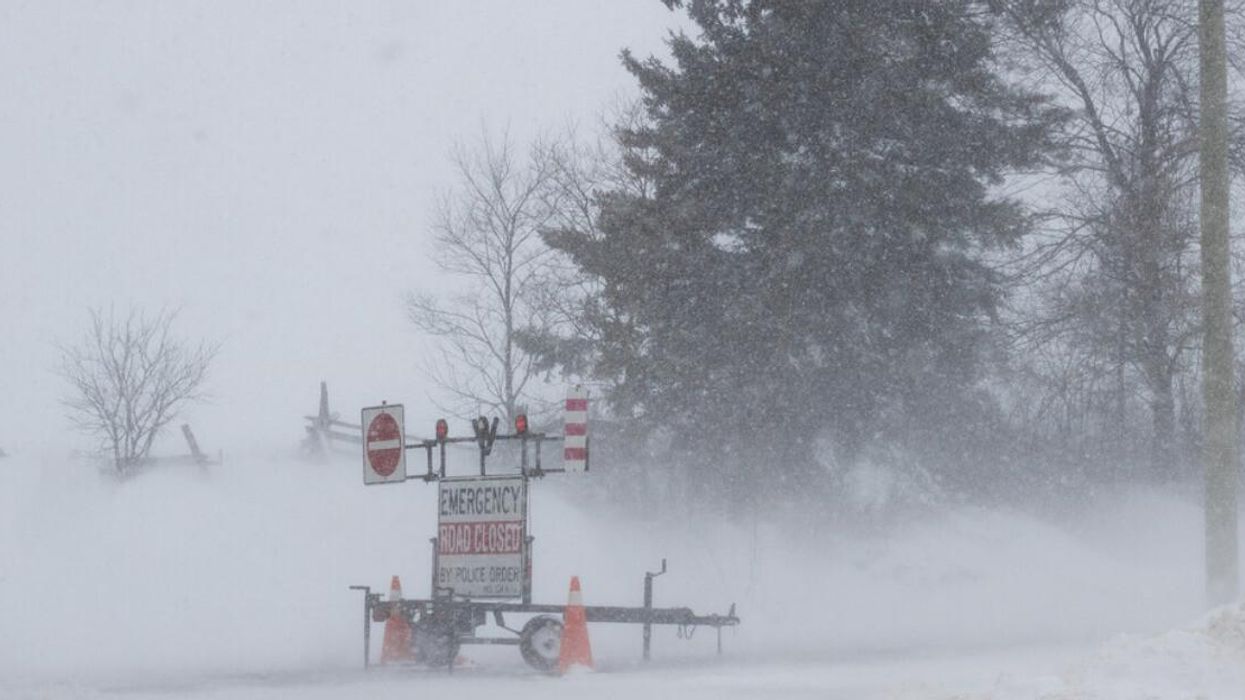 A "road closed" sign is shown in winter.