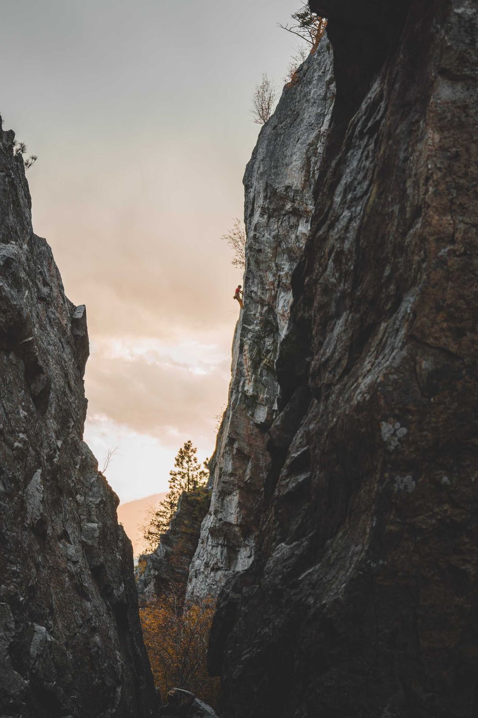 A rock climber scales a cliff at Skaha Bluffs.