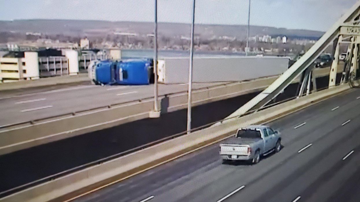 A rolled over transport truck on the Burlington Skyway.