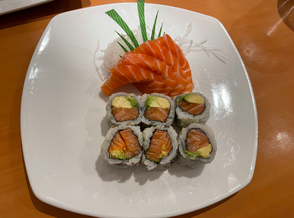 A salmon avocado roll and sashimi from Echo Sushi.