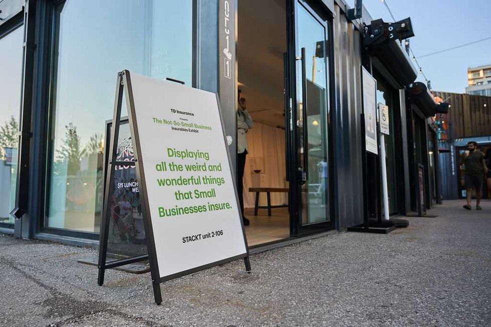 A sandwich board outside the STACKT TD Insurance pop-up that reads 