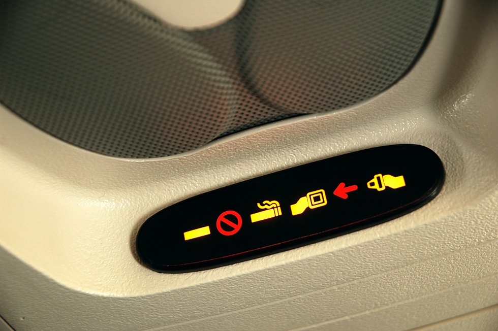 A seatbelt sign on an airplane.