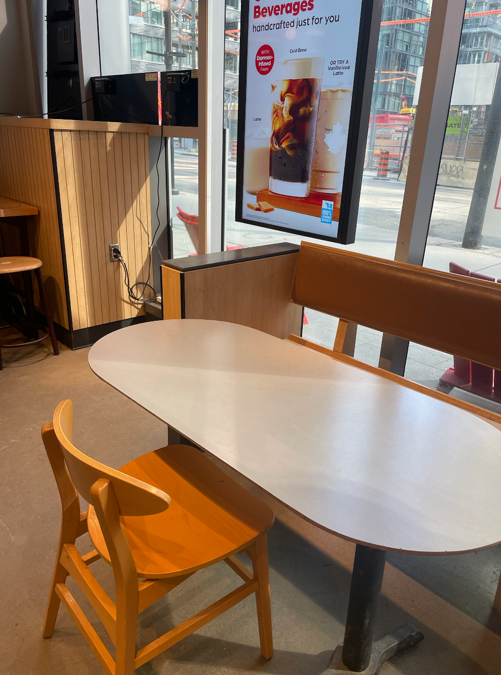A section of the seating area in the 375 King Street West Tim Hortons location.
