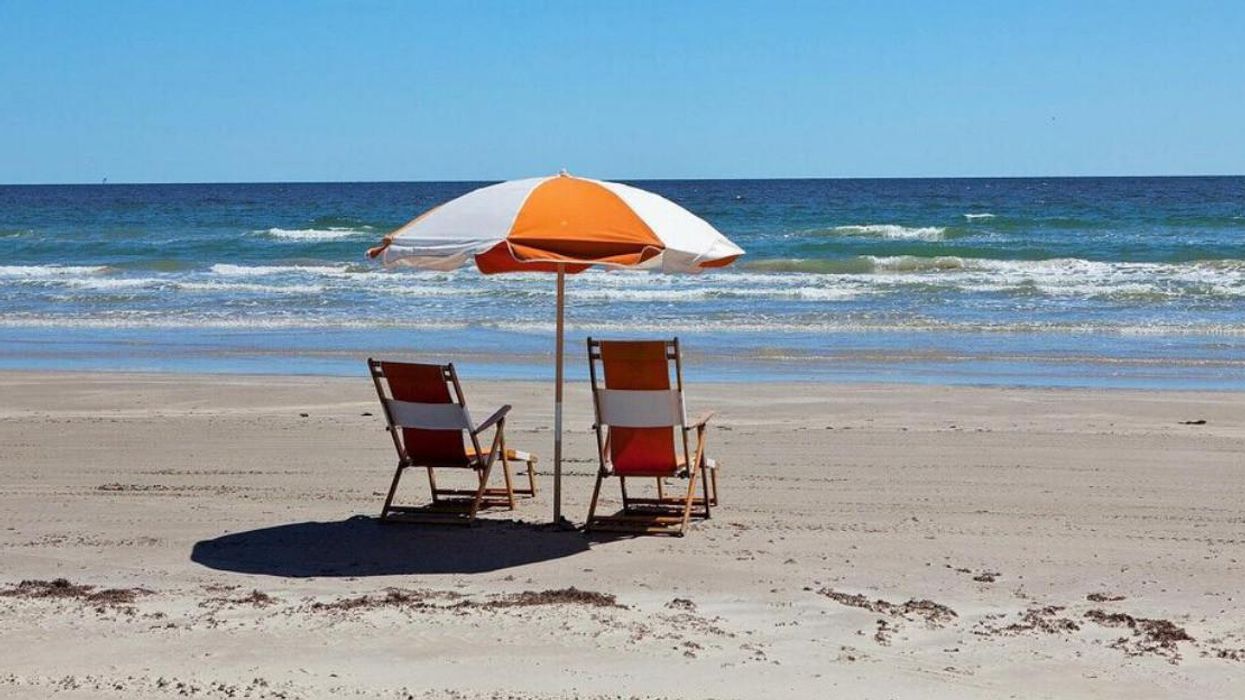 A set of beach chairs and an umbrella on Rockport Beach.