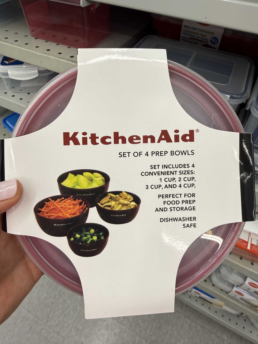 A set of four red food prep bowls with lids.