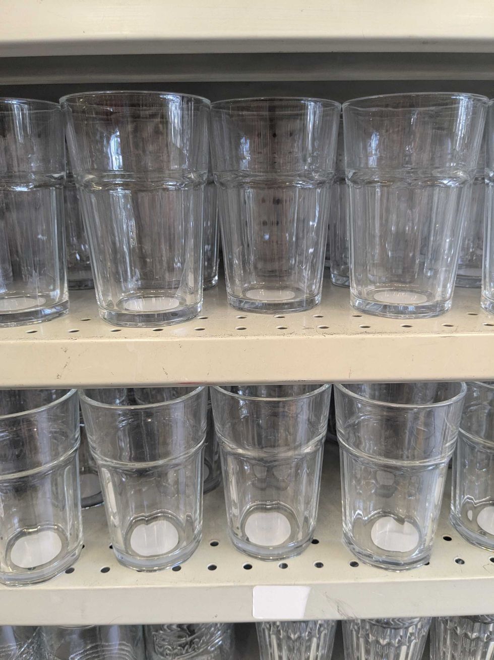 A shelf full of glasses at Dollarama