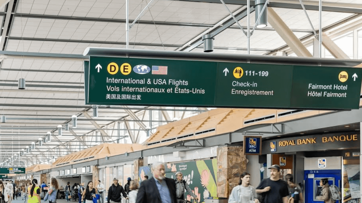 A sign in Vancouver Airport that reads "International & USA flights."