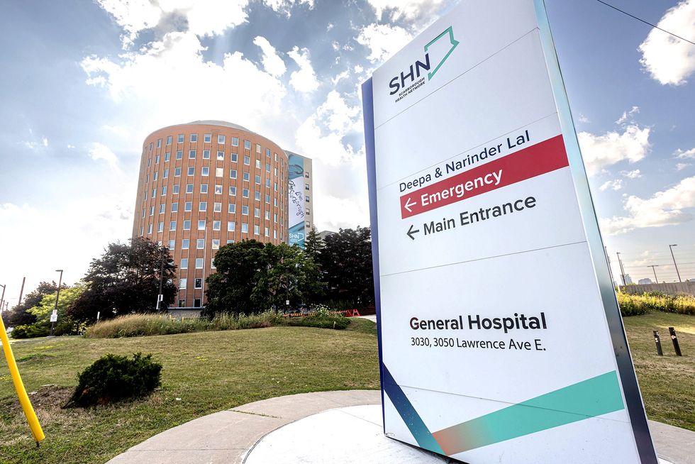 A sign outside Scarborough General Hospital directing people toward the emergency and main main entrances.