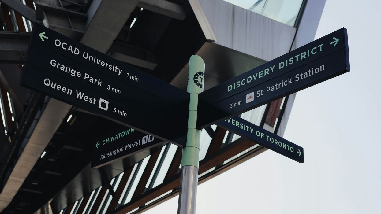 A sign pointing out Toronto locations.