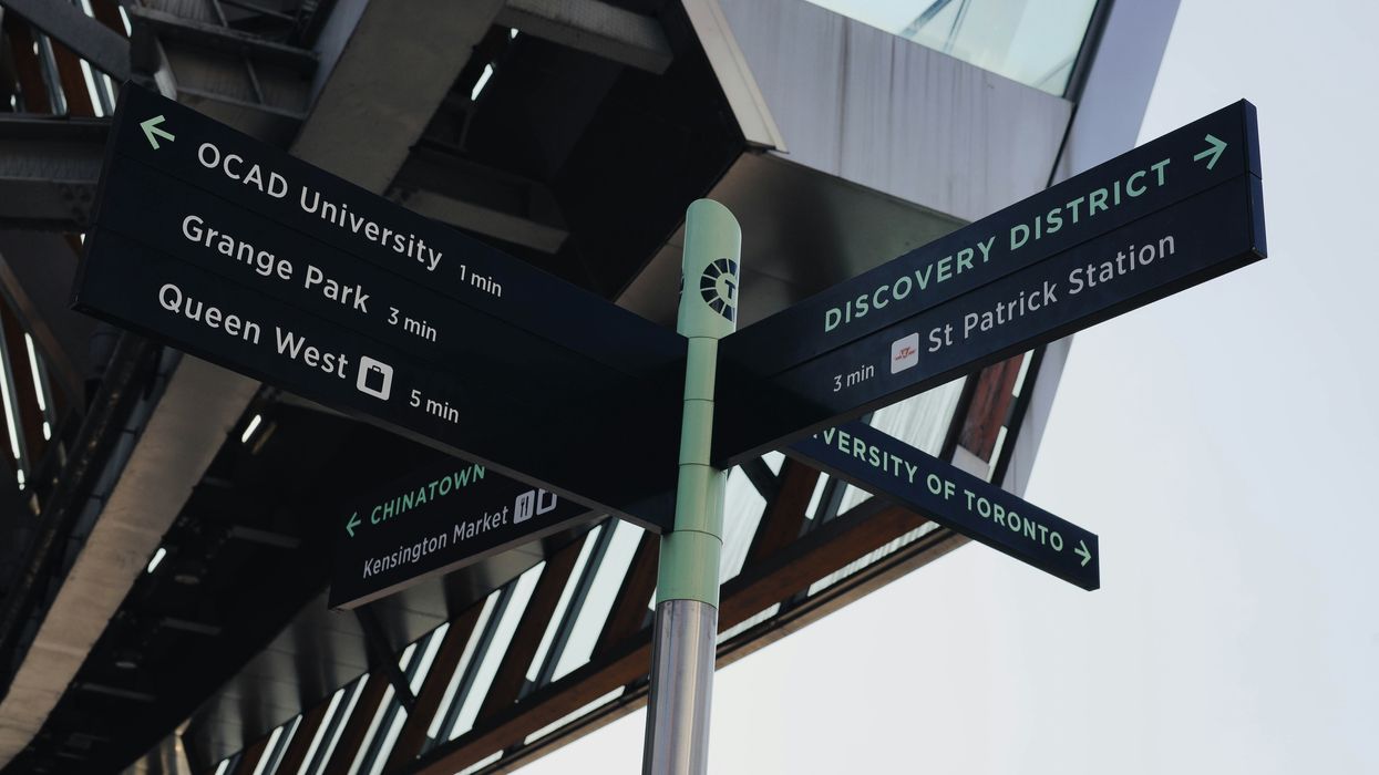 A sign pointing out Toronto locations.