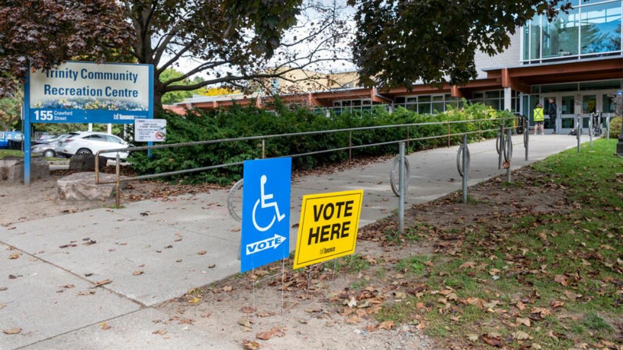 A sign points voters in the direction to cast their ballot.