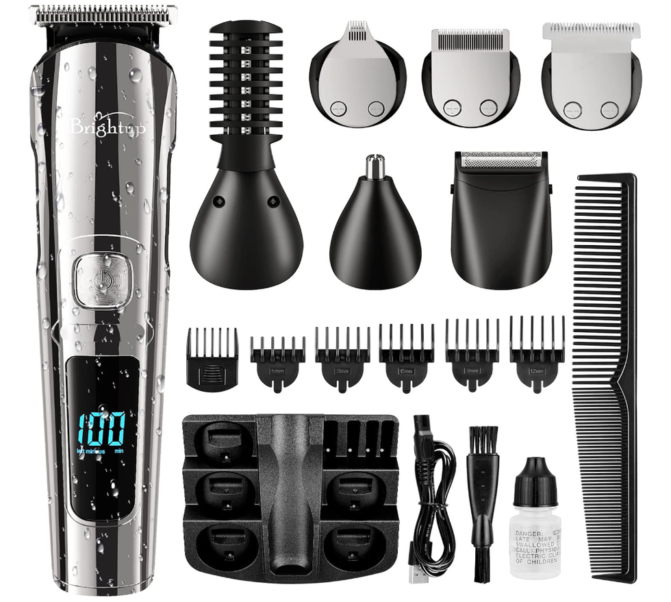 A silver and black beard and hair trimmed with a bunch of accessories like a comb and changing heads.