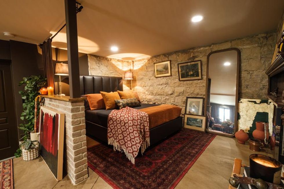 A sitting room decorated in dark colours.