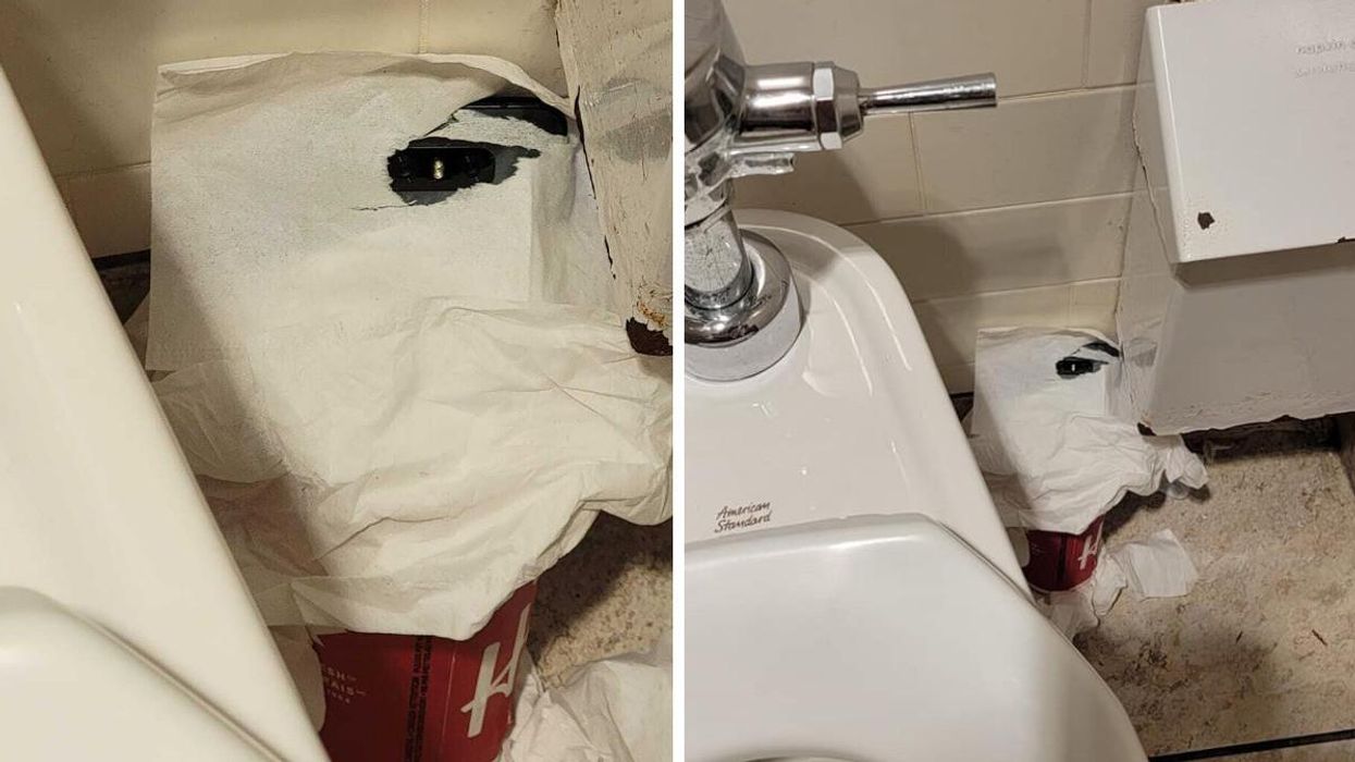 A smartphone camera on a Tim Hortons cup in the women's washroom in Ontario.