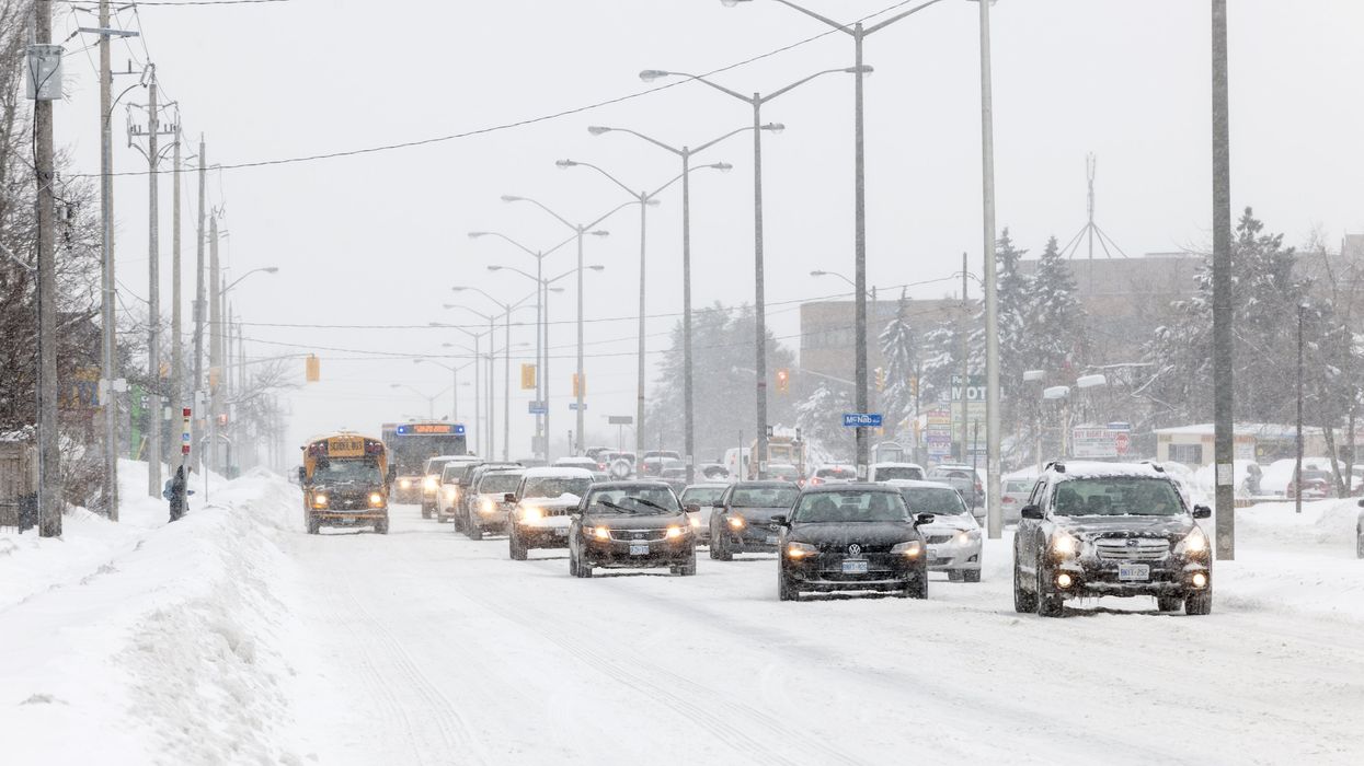A snow-covered road in southern Ontario during a snowstorm.