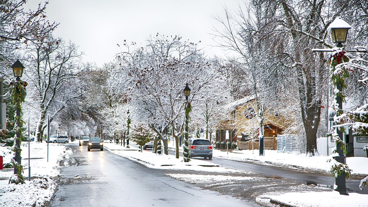 A snowy street with Christmas decorations (illustrative).