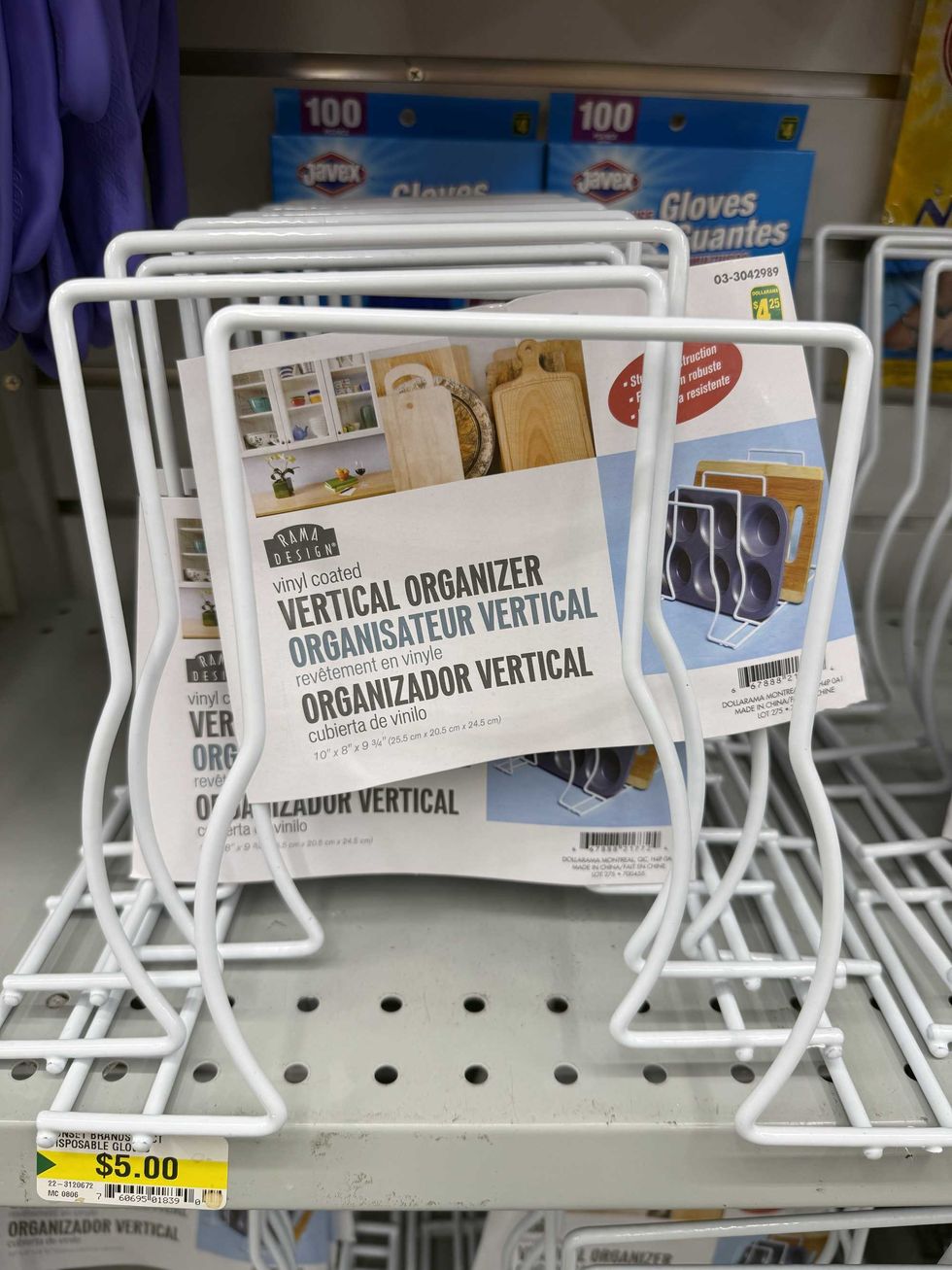 A stack of white vinyl coated vertical organizers on a store shelf.