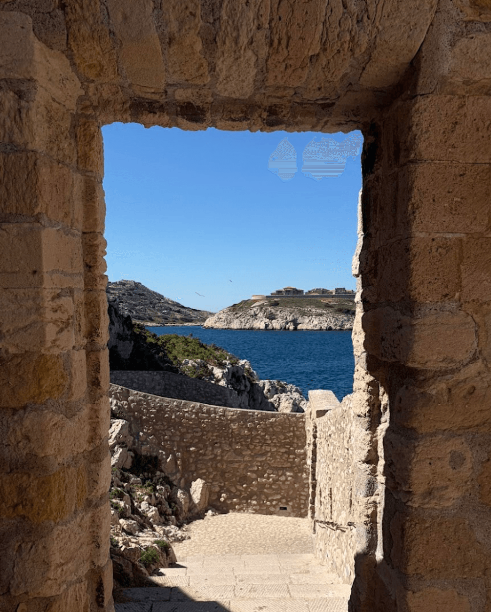 A stone doorway overlooking the sea.