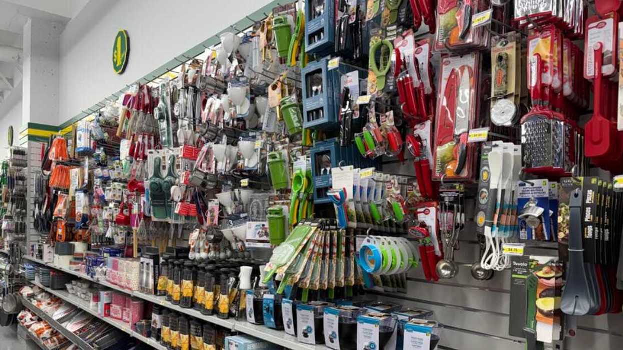 A store wall filled with various kitchen tools and gadgets.