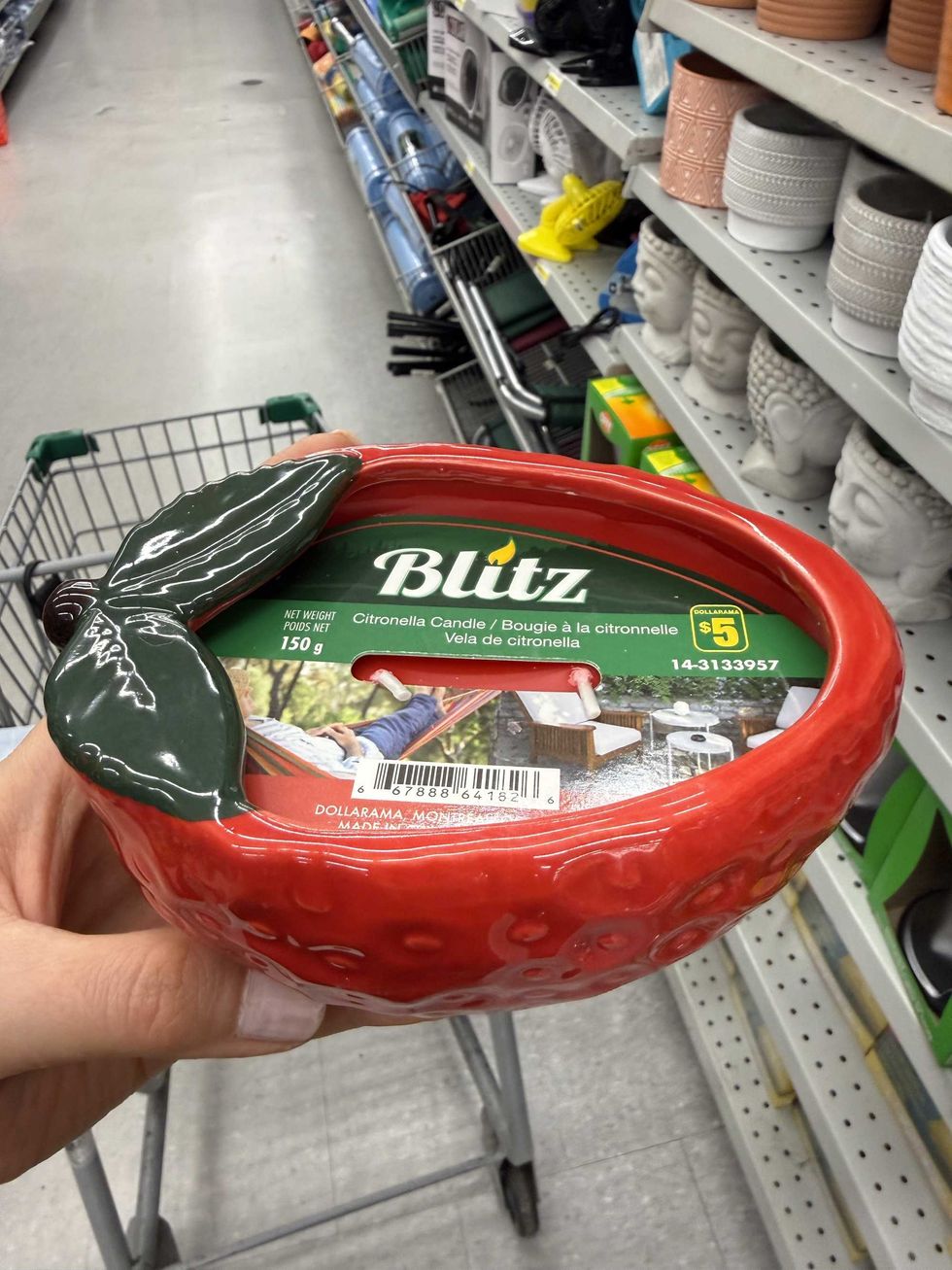 A strawberry shaped citronella candle.