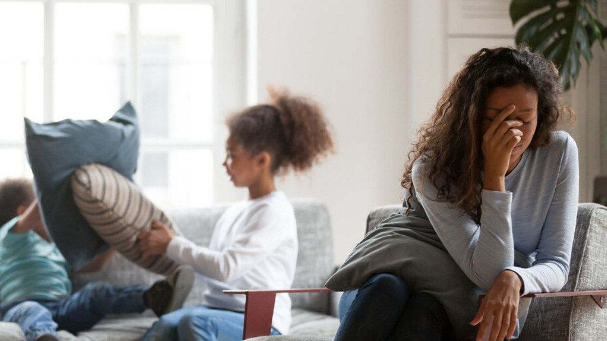 A stressed out mom with her kids.
